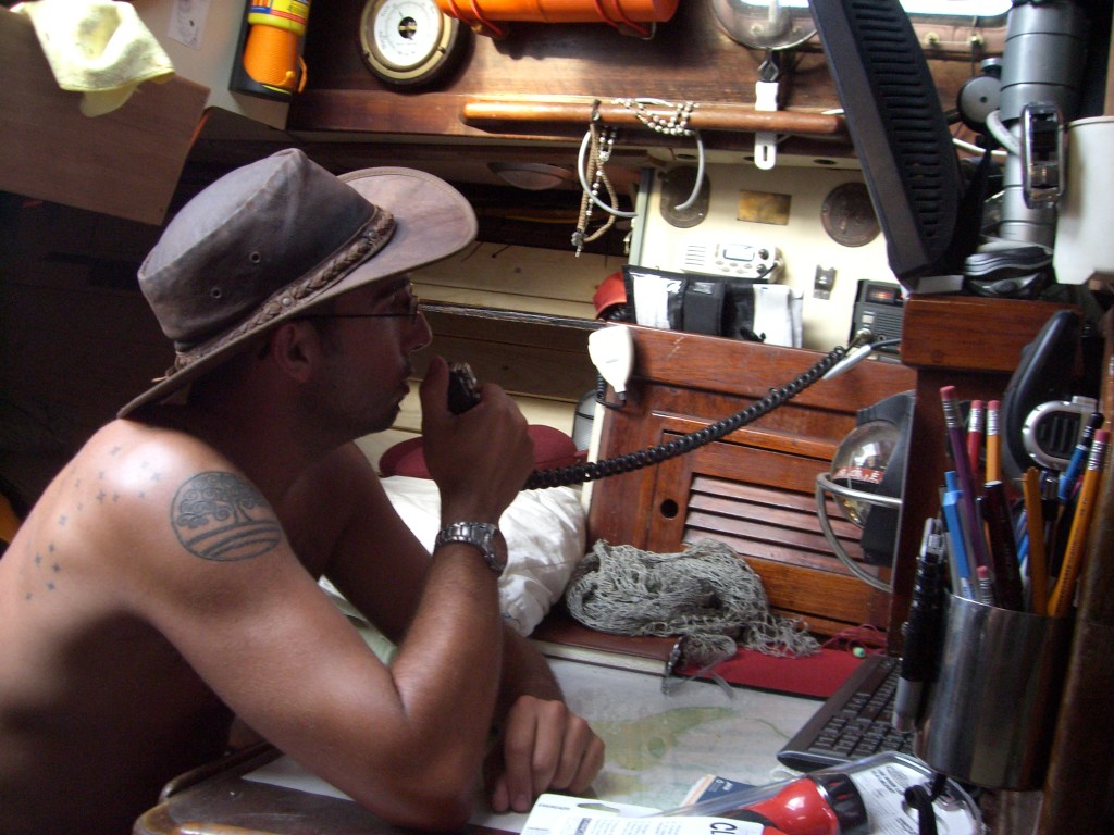 Two days from landfall in Yap, 2009. A busy skipper communicating via Ham radio. Twitter? What?